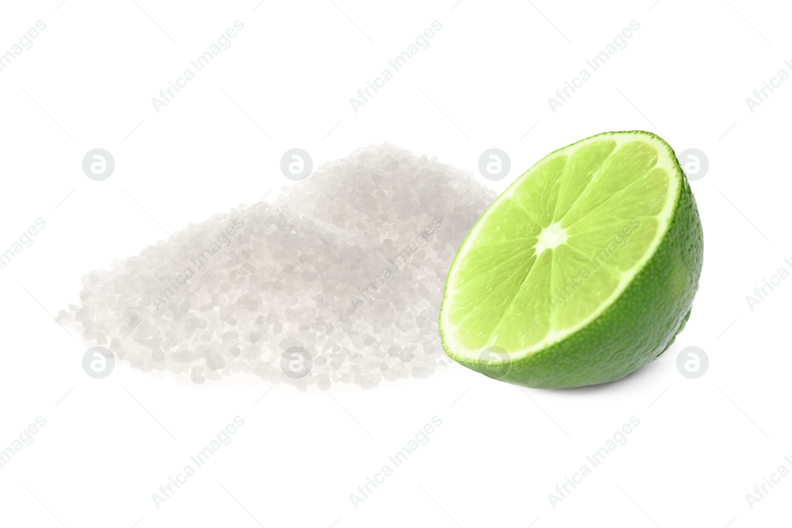 Image of Cut lime and salt isolated on white. Margarita cocktail ingredients