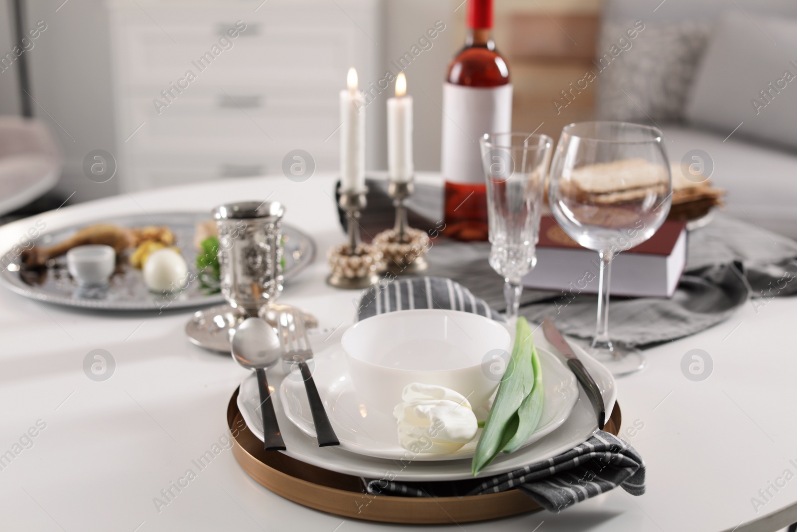 Photo of Festive Passover table setting at home. Pesach celebration