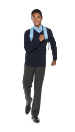 African American teenage boy in stylish school uniform on white background