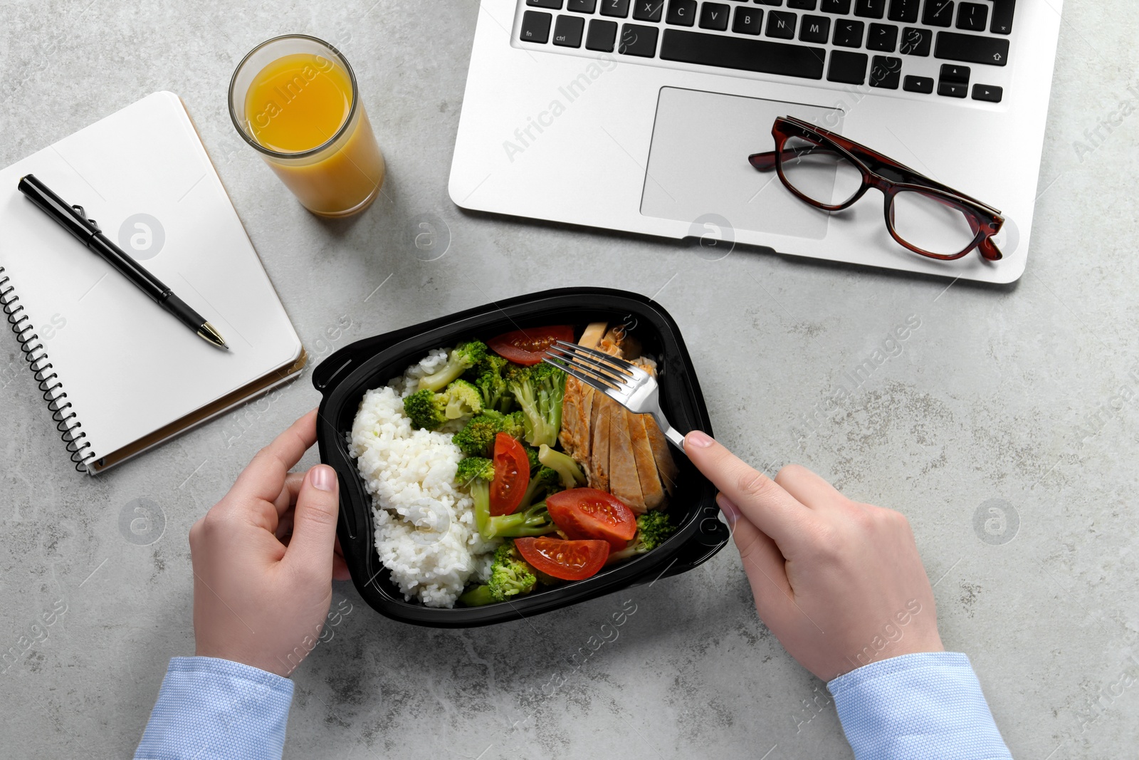 Photo of Office employee having business lunch at workplace, top view