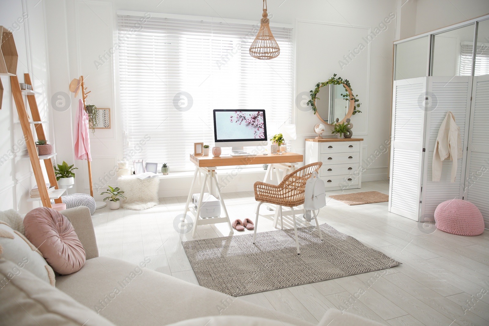 Photo of Stylish home office interior with sofa and comfortable workplace