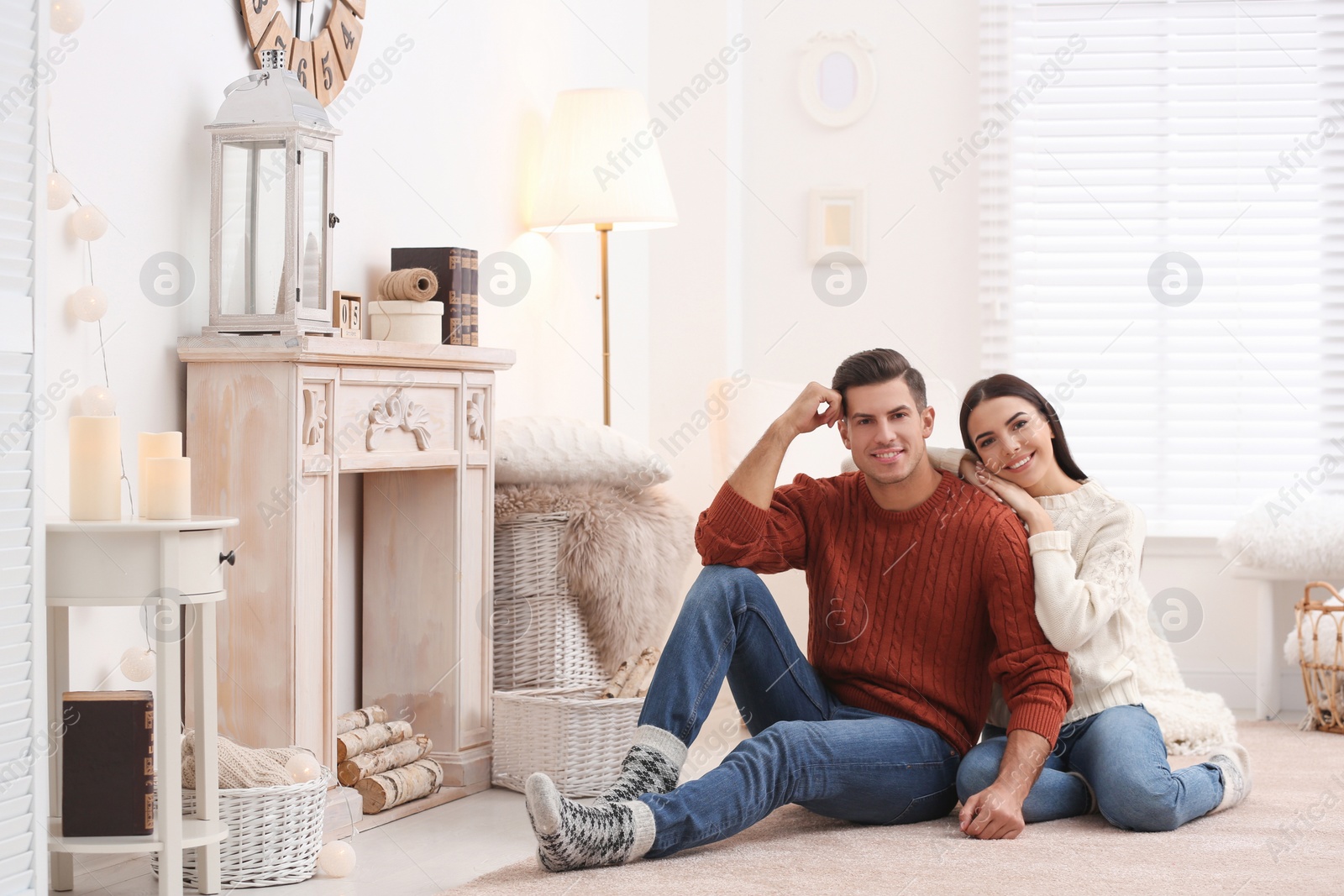 Photo of Happy couple spending time together at home. Winter vacation