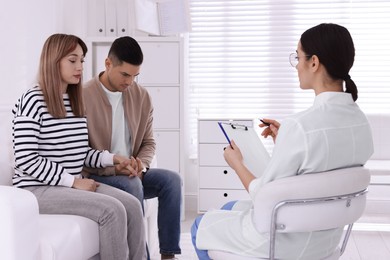 Photo of Couple having appointment with STD specialist in clinic