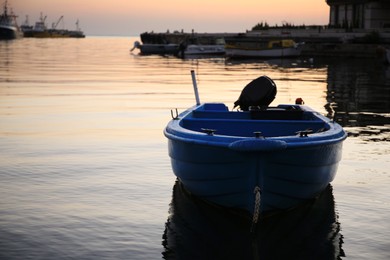 Photo of Beautiful view of river with moored boat at sunset