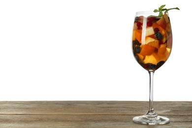 Photo of Glass of Red Sangria on wooden table against white background. Space for text