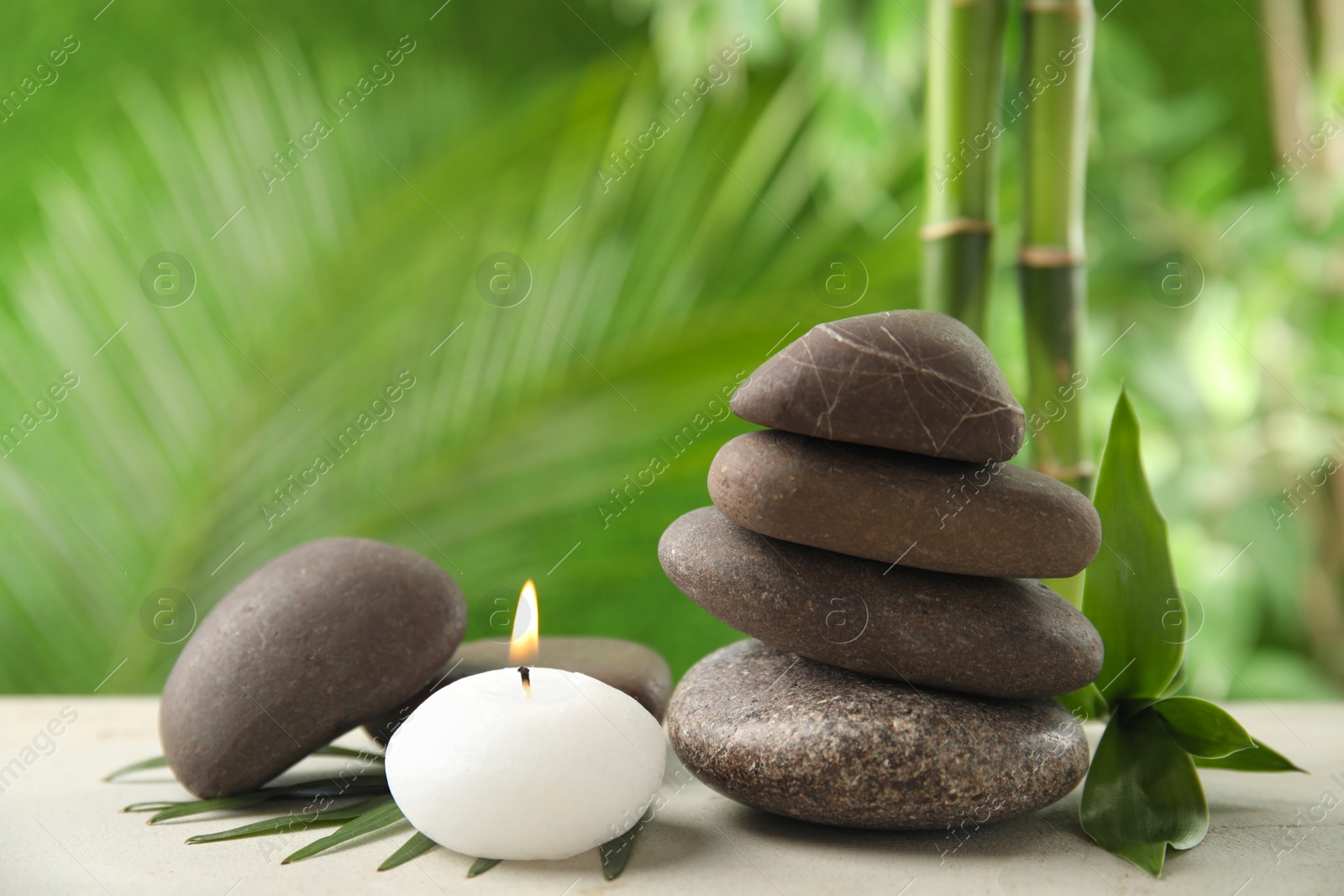 Photo of Composition with stones on table against blurred background. Zen concept