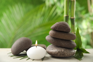 Photo of Composition with stones on table against blurred background. Zen concept