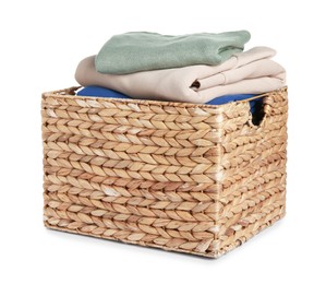 Photo of Wicker laundry basket with clean clothes isolated on white