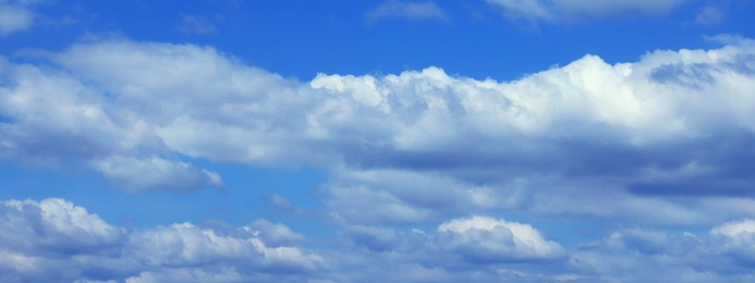 Image of Beautiful blue sky with white fluffy clouds. Banner design