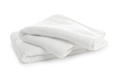 Photo of Folded clean soft towels on white background