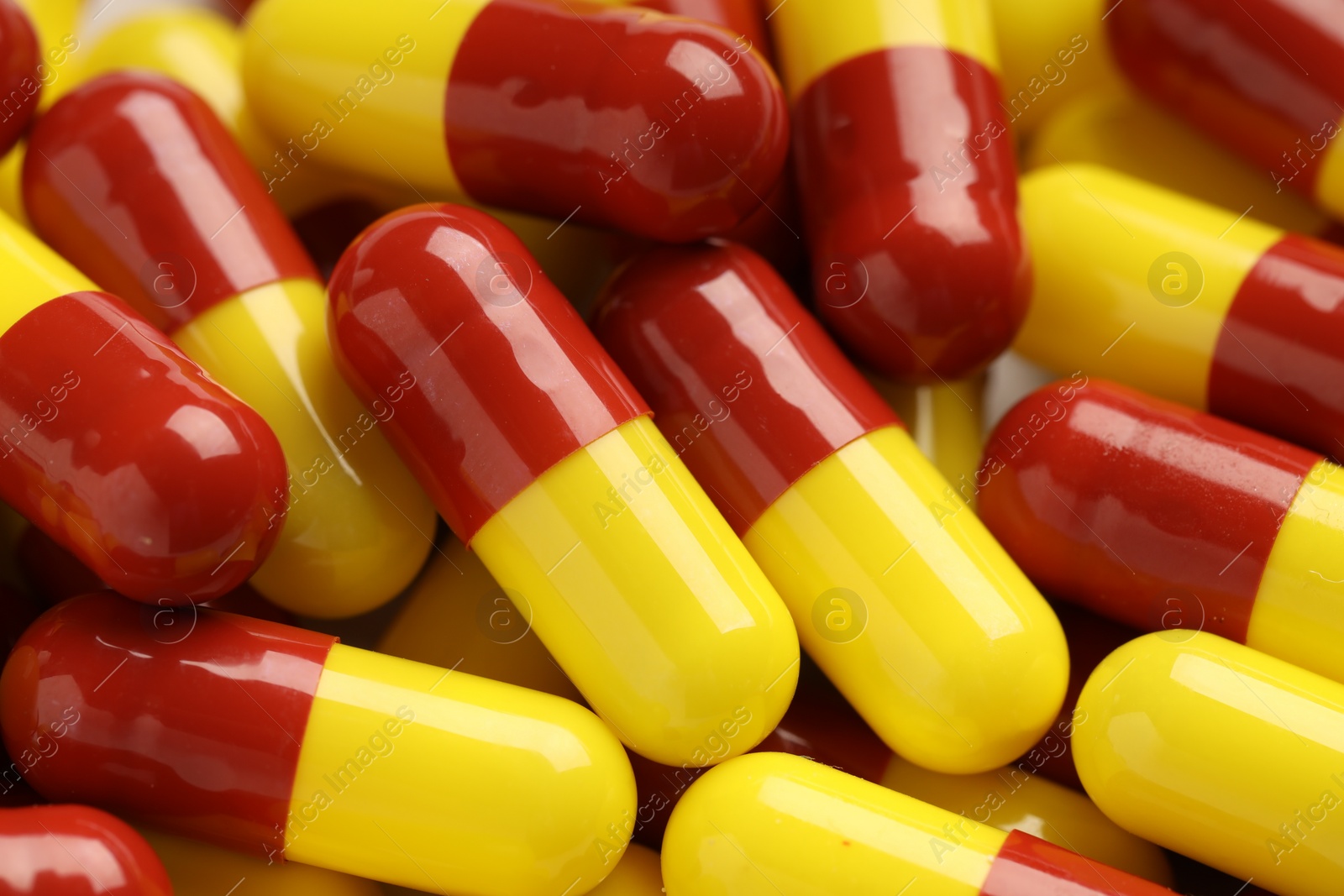 Photo of Many antibiotic pills as background, closeup. Medicinal treatment