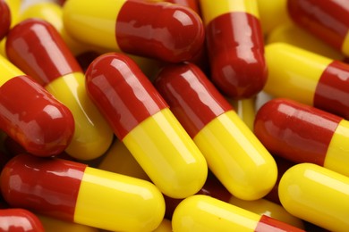 Photo of Many antibiotic pills as background, closeup. Medicinal treatment