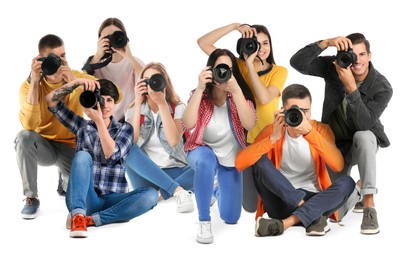 Image of Group of professional photographers with cameras on white background