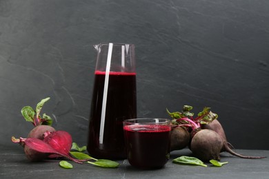 Photo of Freshly made beet juice on black table