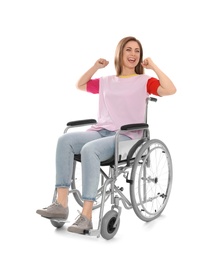 Happy woman in wheelchair isolated on white