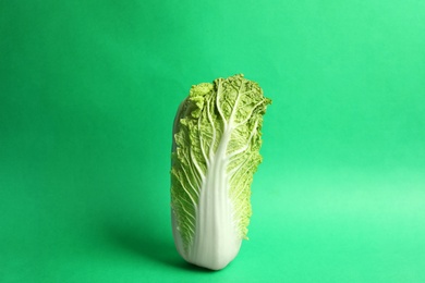 Photo of Fresh ripe cabbage on color background