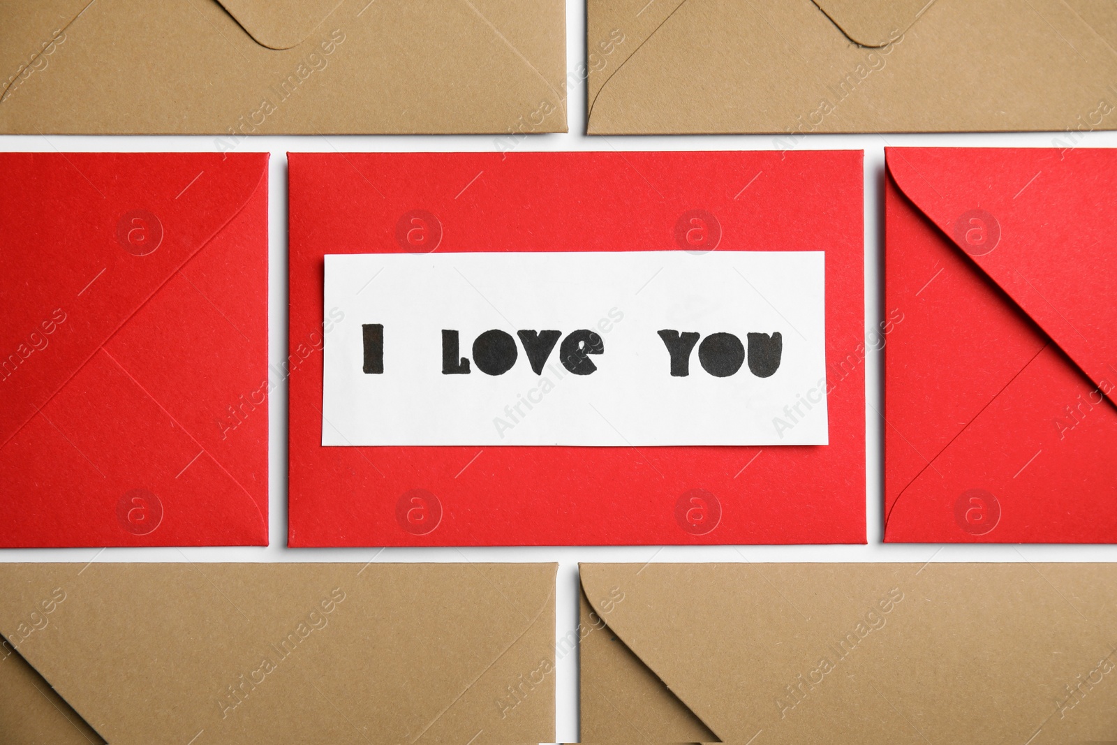 Photo of Card with phrase I Love You and envelopes on white background, flat lay