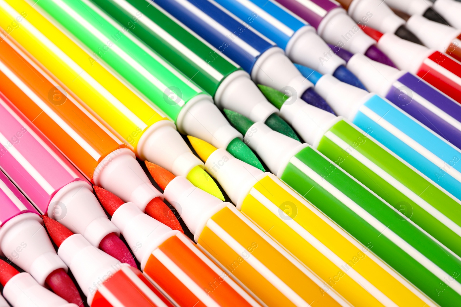 Photo of Many bright markers as background, closeup view