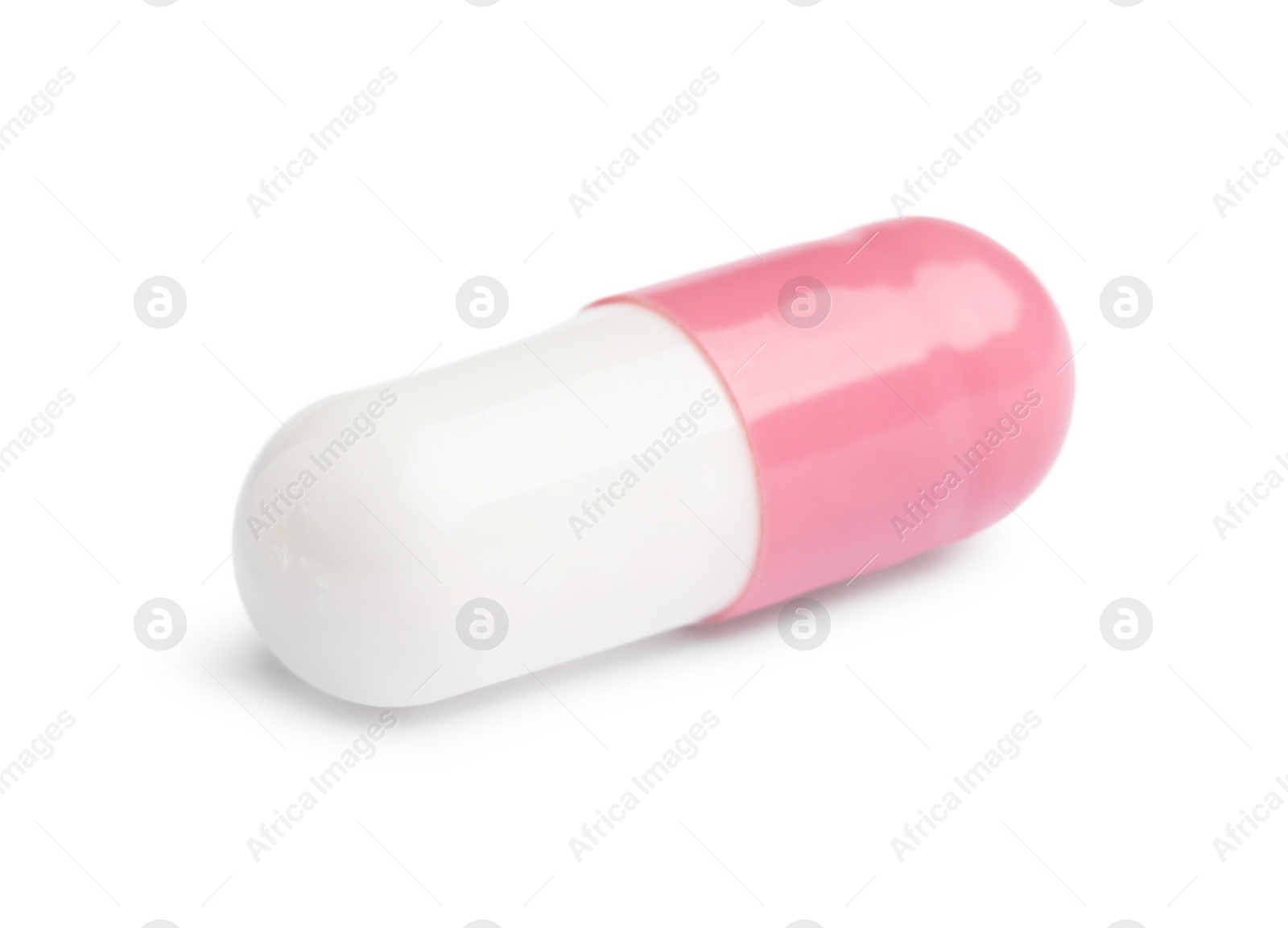 Photo of One pill on white background. Medicinal treatment