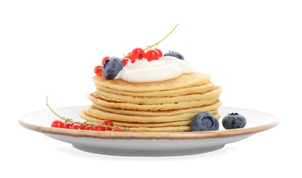 Photo of Tasty pancakes with natural yogurt, blueberries and red currants on white background