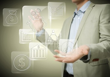 Image of Budget management. Businessman demonstrating virtual financial icons against light background, closeup