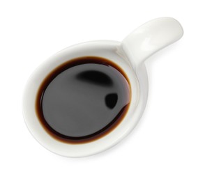 Tasty soy sauce in gravy boat isolated on white, top view
