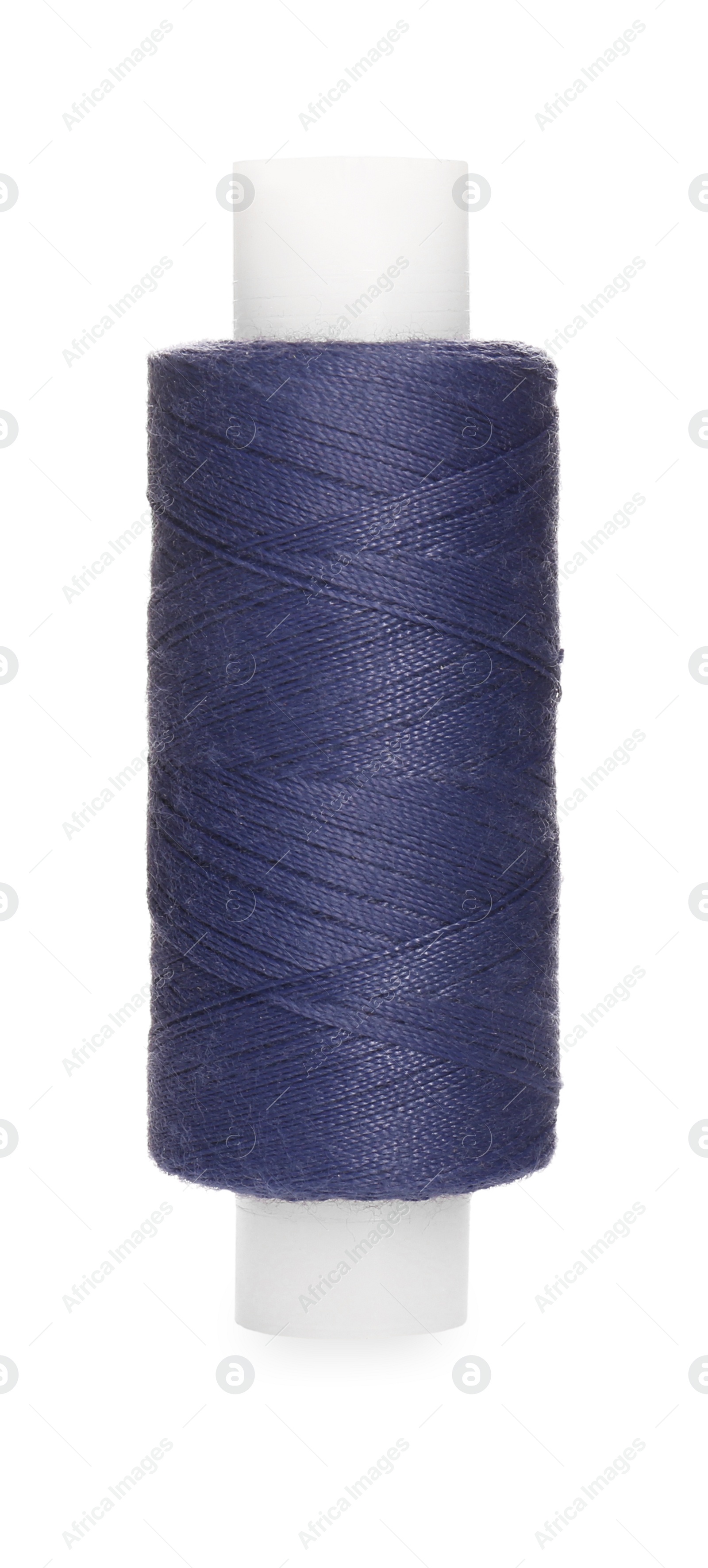 Photo of Spool of dark blue sewing thread isolated on white