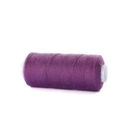 Photo of Spool of purple sewing thread isolated on white