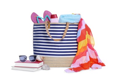 Photo of Stylish bag, books and other beach accessories isolated on white