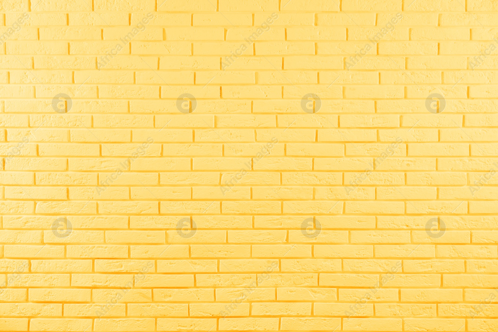 Image of Stylish yellow brick wall as background. Simple design