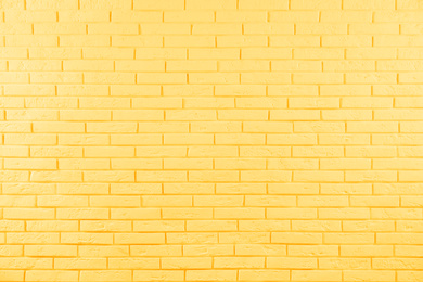 Image of Stylish yellow brick wall as background. Simple design