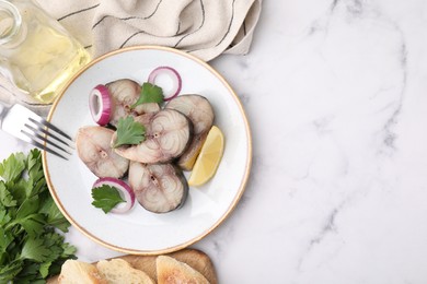 Photo of Slices of tasty salted mackerel served on white marble table, flat lay. Space for text