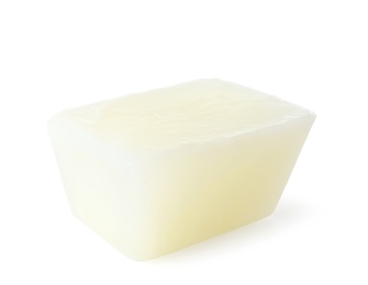 Photo of Tasty milk ice cube on white background