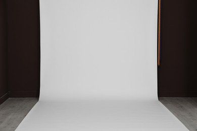 Photo of Empty white photo background. Professional studio equipment