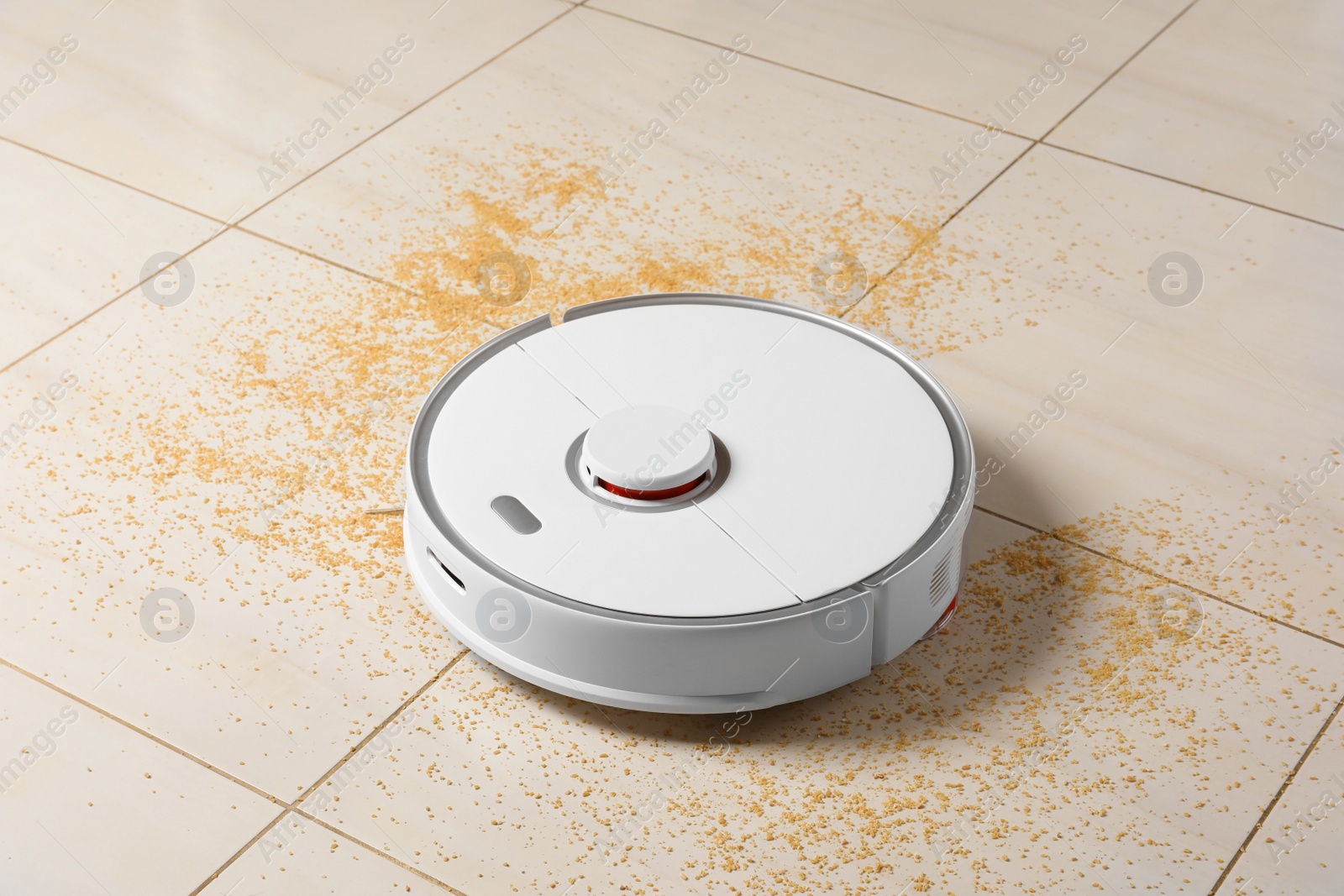 Photo of Robot vacuum cleaner removing dirt from floor in room