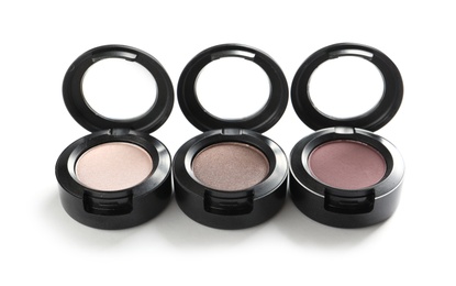 Photo of Different eye shadows on white background. Decorative cosmetics