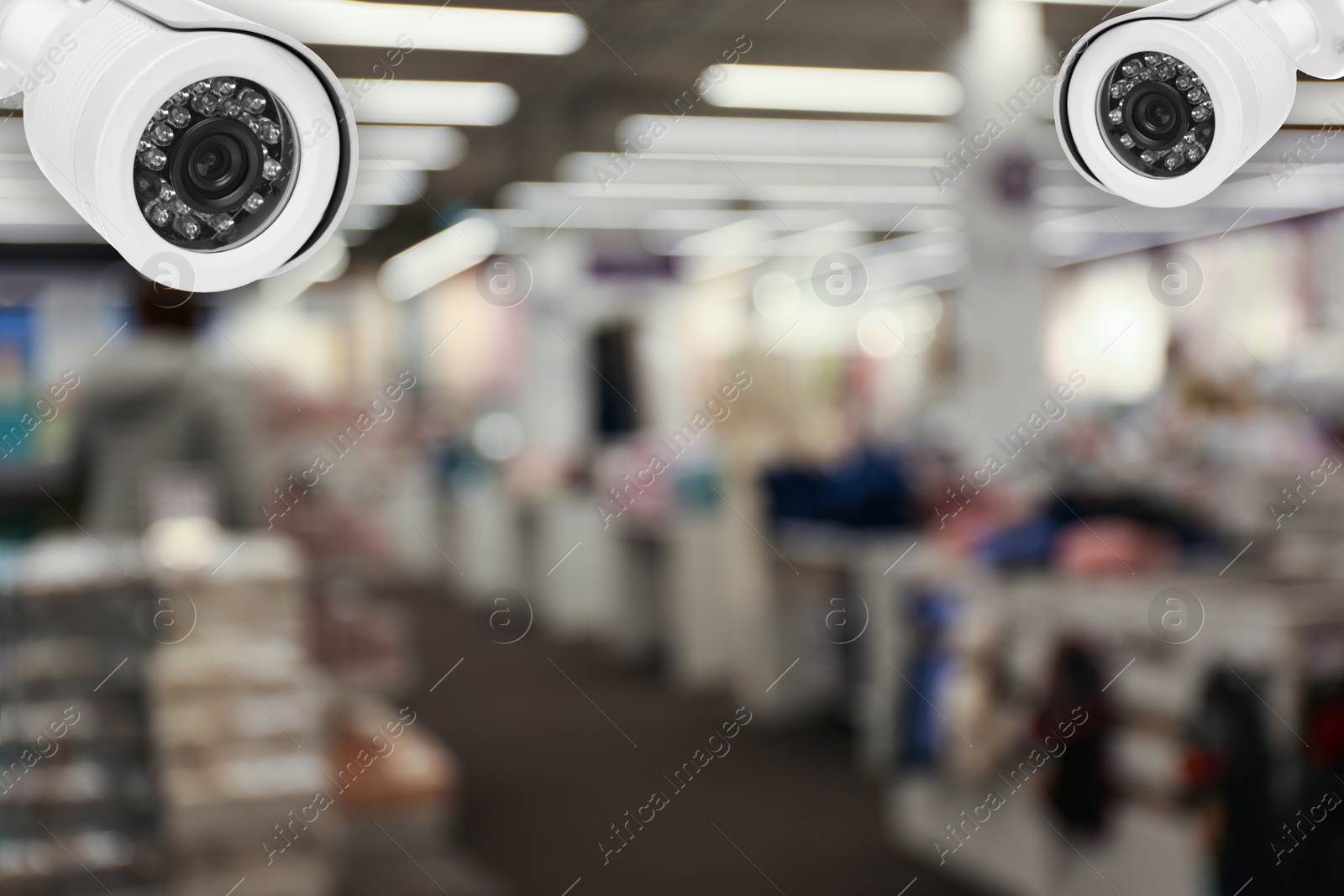 Image of Modern CCTV security cameras in shopping mall. Guard equipment