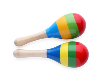 Photo of Colorful maracas on white background, top view. Musical instrument
