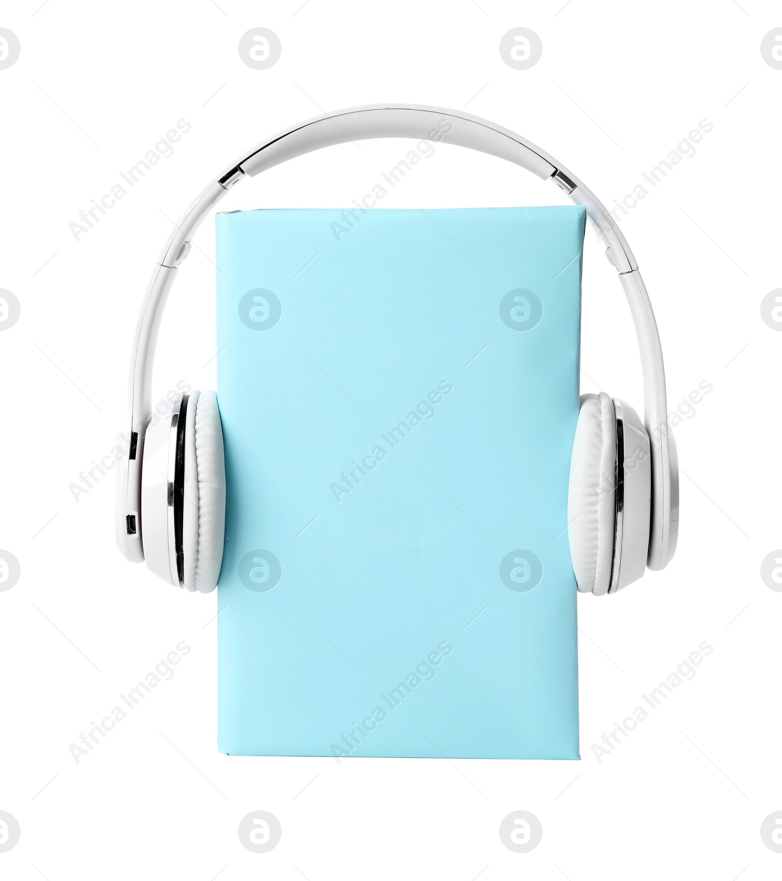 Photo of Book with blank cover and headphones isolated on white