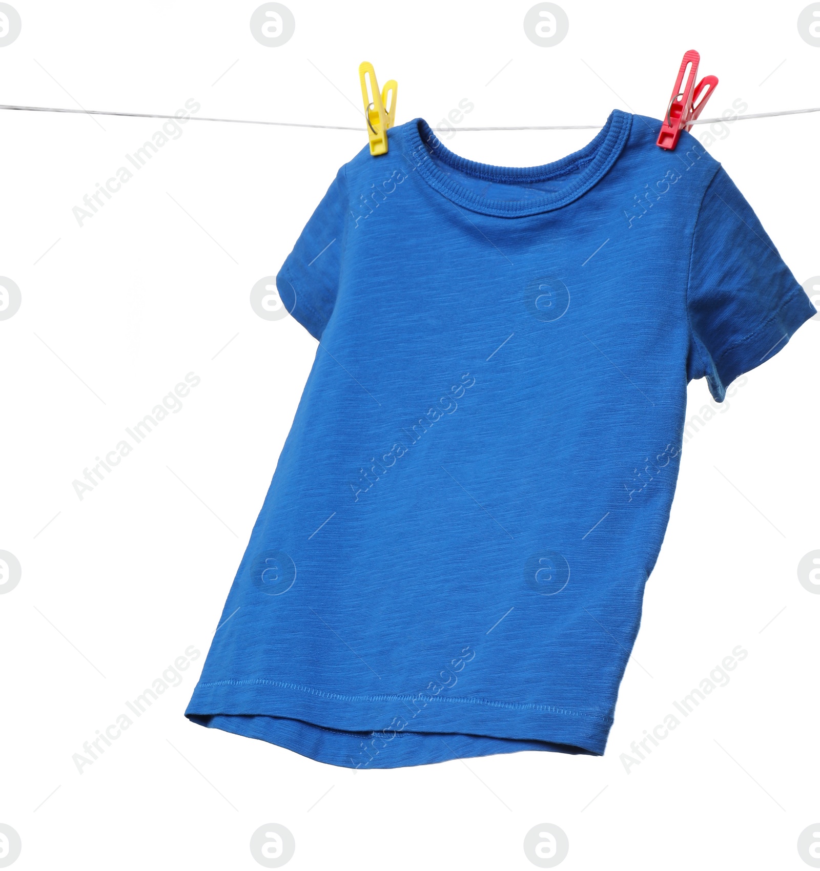 Photo of One blue t-shirt drying on washing line isolated on white