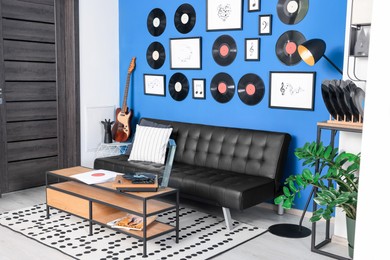 Living room decorated with vinyl records. Interior design