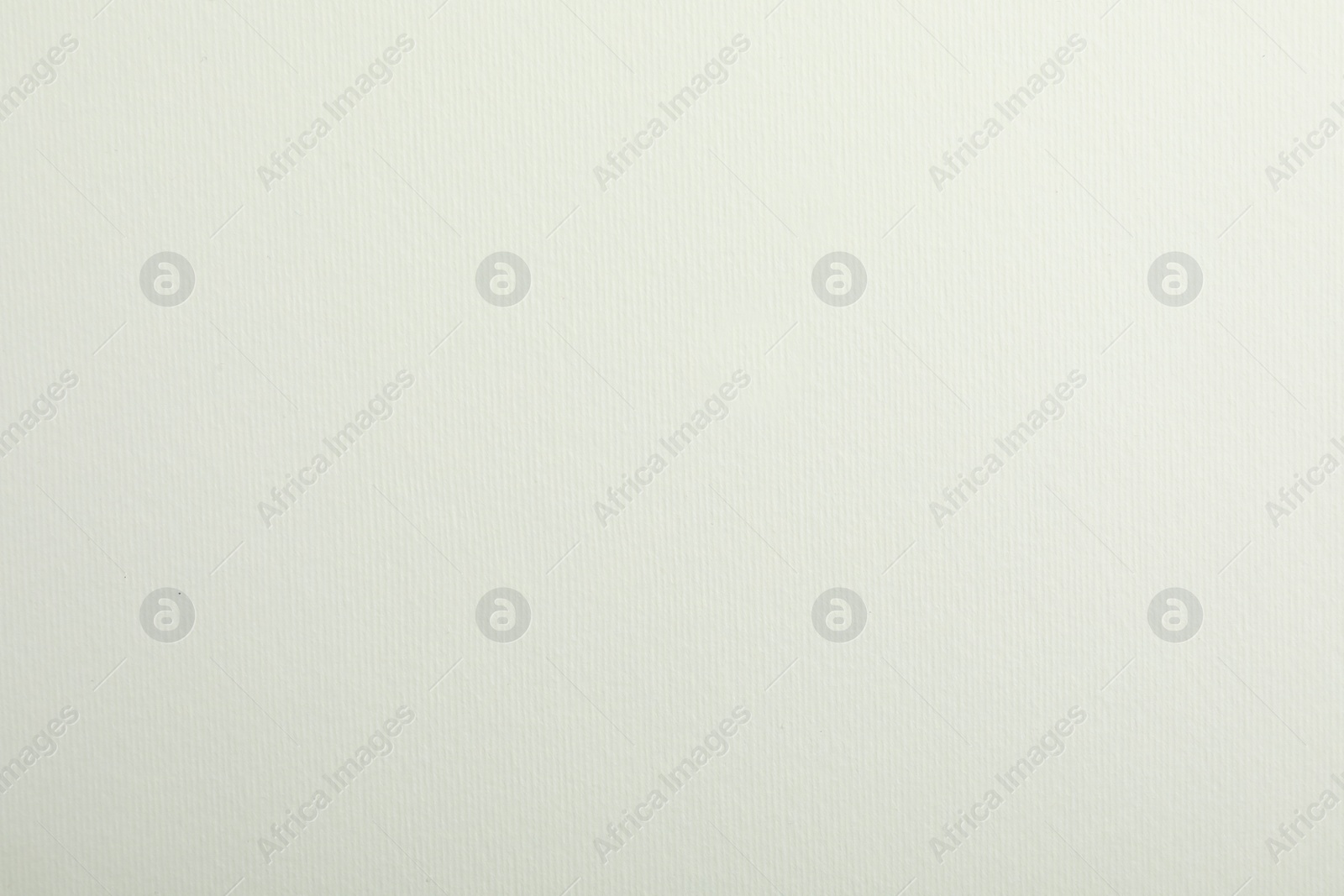 Photo of White textured paper sheet as background, top view