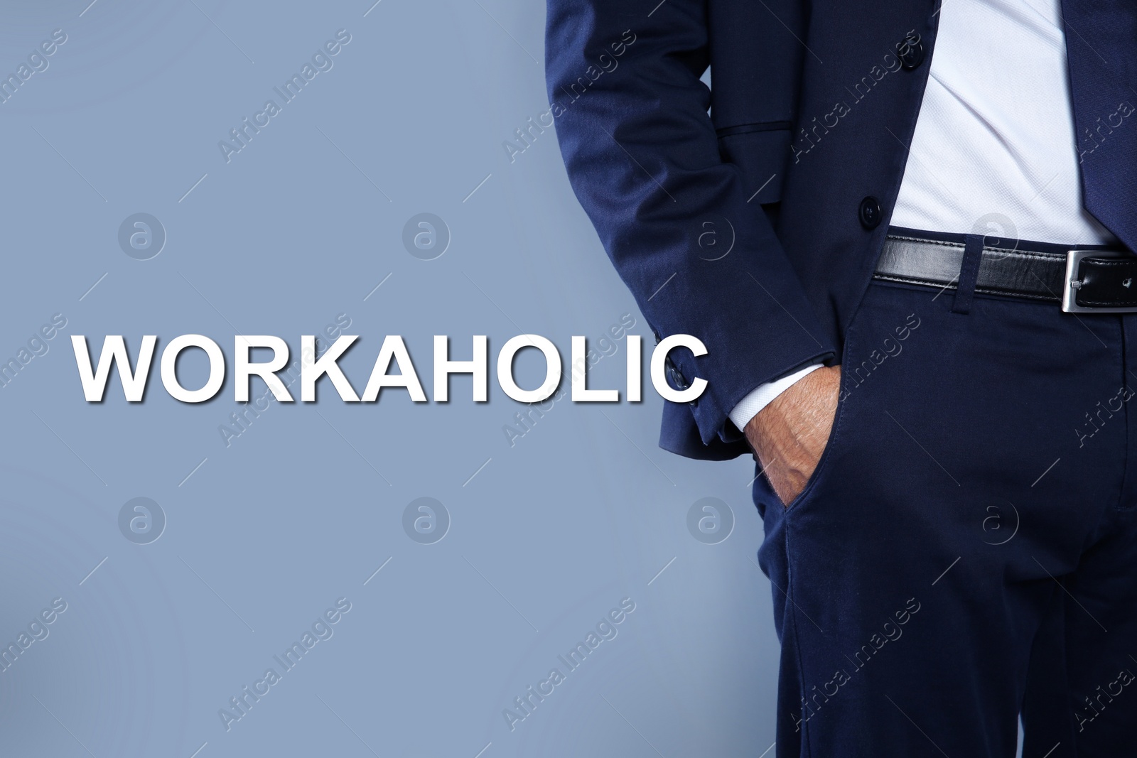 Image of Man with hand in pocket and word Workaholic on light grey background, closeup