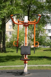 Outdoor gym with exercise machine in park