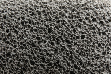 Photo of Texture of pumice stone as background, closeup