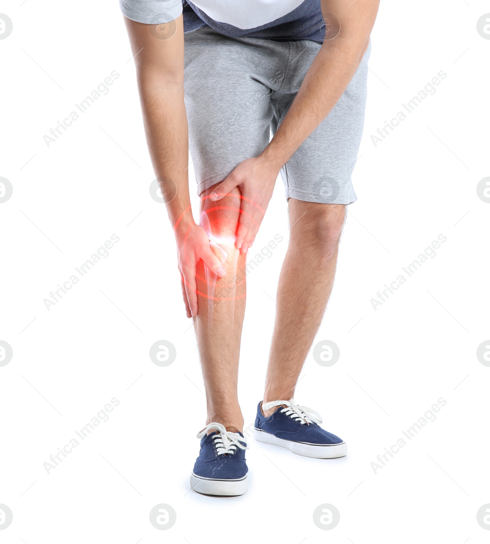 Image of Man suffering from knee pain on white background, closeup