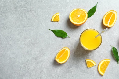 Photo of Glass of orange juice and fresh fruits on table, top view