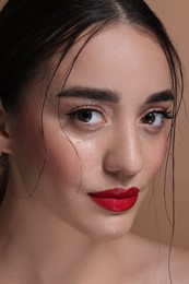 Portrait of beautiful young woman with red lips, closeup