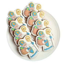 Tasty gingerbread cookies on white background, top view. St. Nicholas Day celebration