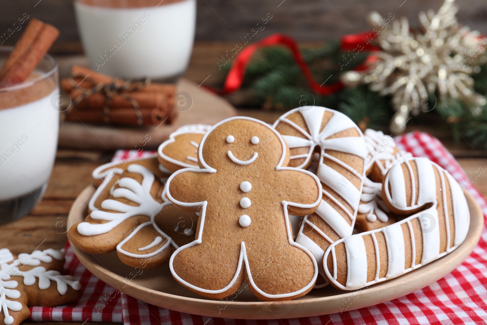 Photo of Delicious gingerbread Christmas cookies on table, closeup